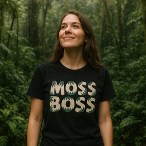 Lifestyle shot of the "Moss Boss" black hoh rainforest t shirt in a real-world setting