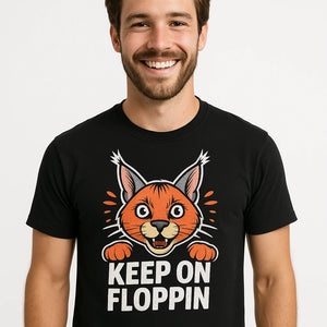 Close-up of the "Keep on Floppin" orange print on a premium Bella+Canvas black caracal t shirt
