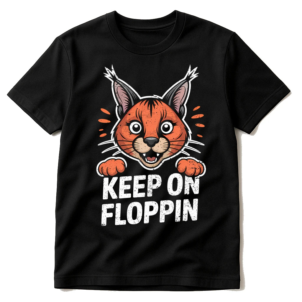 Black Caracal T Shirt - "Keep on Floppin" graphic tee with orange print, flat lay product photo