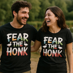 Person wearing the black geese shirts graphic tee - "Fear the Honk" design