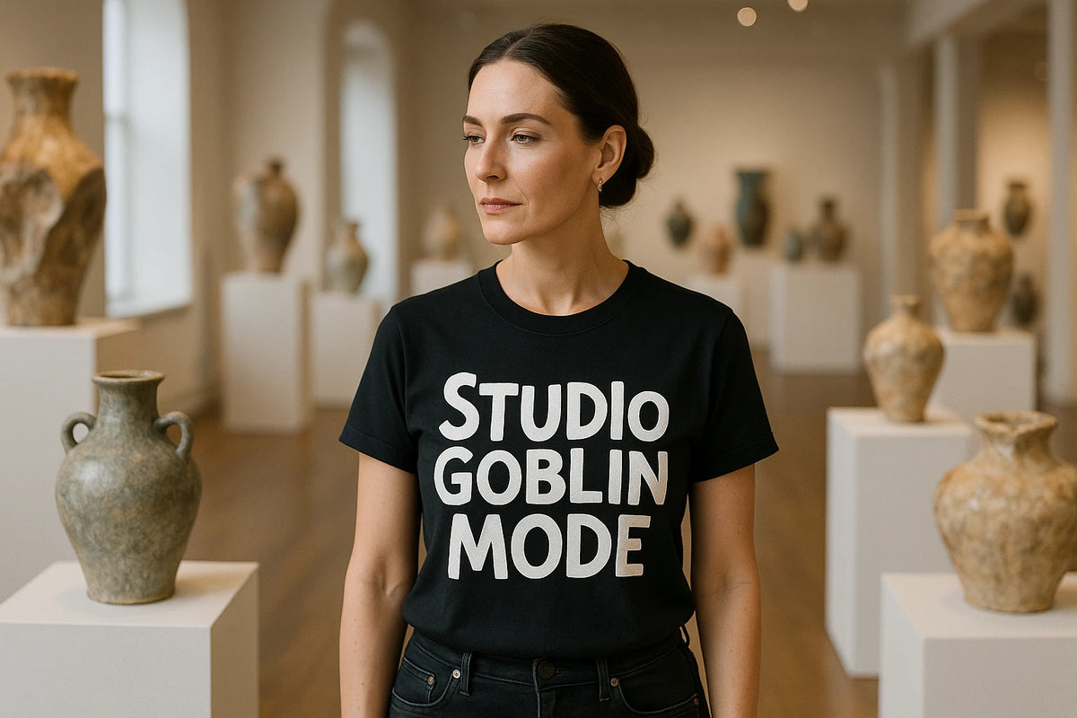 Lifestyle shot of the "Studio Goblin Mode" black online ceramics tee in a real-world setting