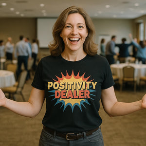Lifestyle shot of the "Positivity Dealer" black growth mindset shirts in a real-world setting