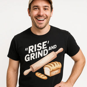 Close-up of the "Rise and Grind" cream print on a premium Bella+Canvas black bakery shirts