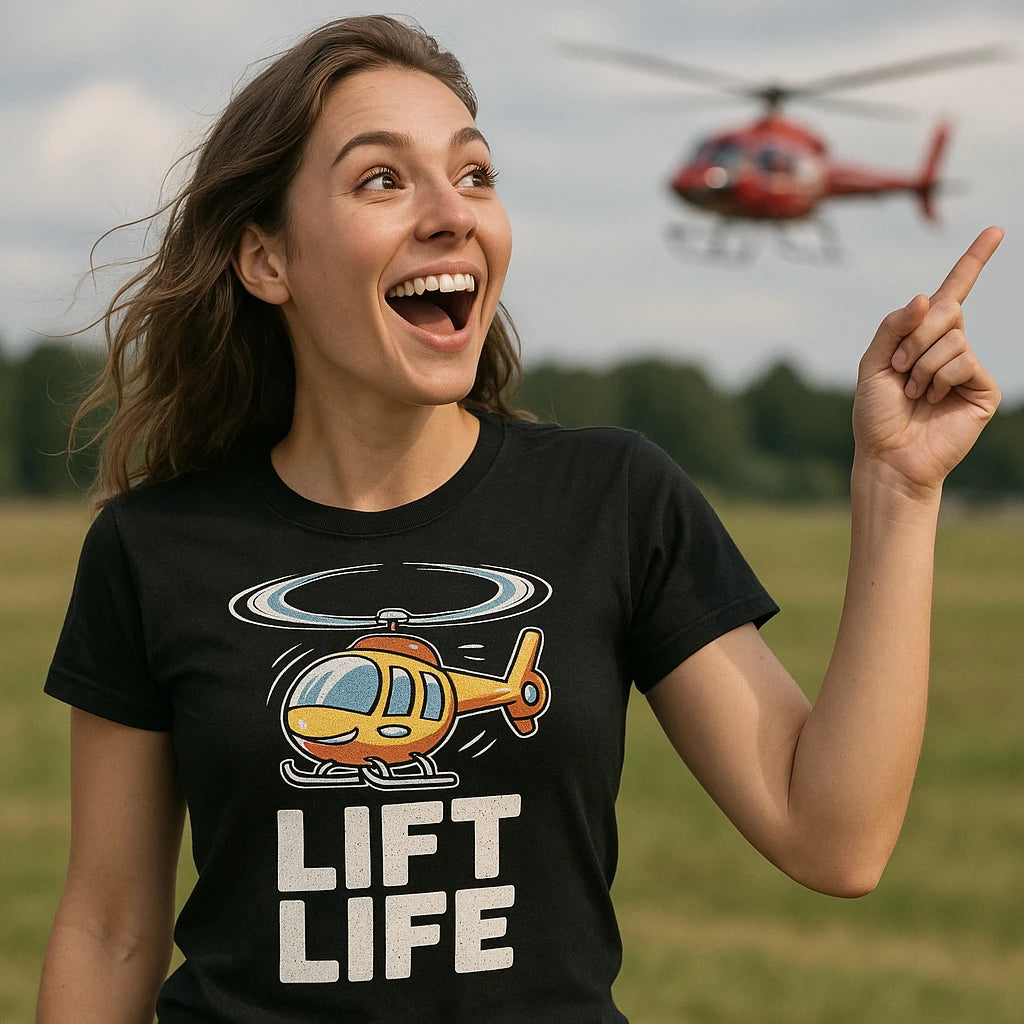A person with long brown hair, wearing a black T-shirt with a cartoon helicopter design and the words "LIFT LIFE," is smiling broadly and pointing to the sky. In the background, a red helicopter is flying. The setting appears to be an open grassy field.