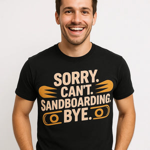 Close-up of the "Sorry. Cant. Sandboarding. Bye." beige print on a premium Bella+Canvas black sandboarding t shirt