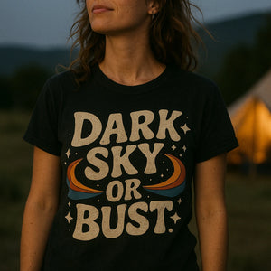 "Dark Sky Or Bust" black stargazing t shirt, photographed as gifts for stargazing lovers