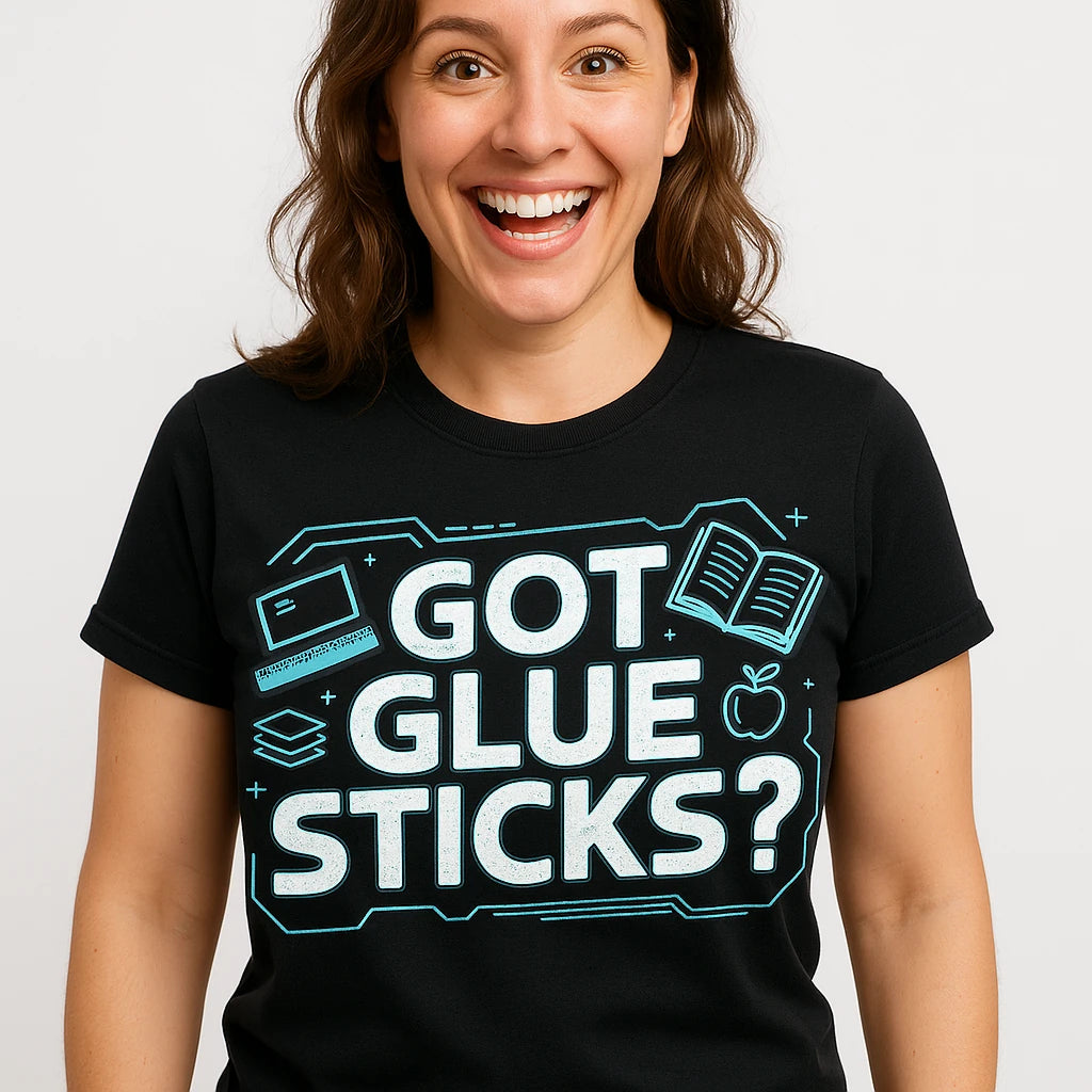 Close-up of the "Got Glue Sticks?" white print on a premium Bella+Canvas black teacher tee shirts