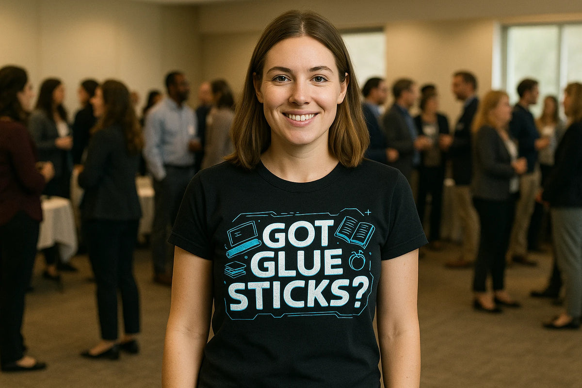 Lifestyle shot of the "Got Glue Sticks?" black teacher tee shirts in a real-world setting