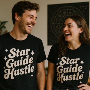 Person wearing the black astrology shirts graphic tee - "Star Guide Hustle" design