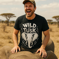 A person wearing a black t-shirt with an elephant graphic and the words 