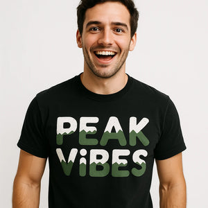 Lifestyle shot of the "Peak Vibes" black national park tee shirts in a real-world setting