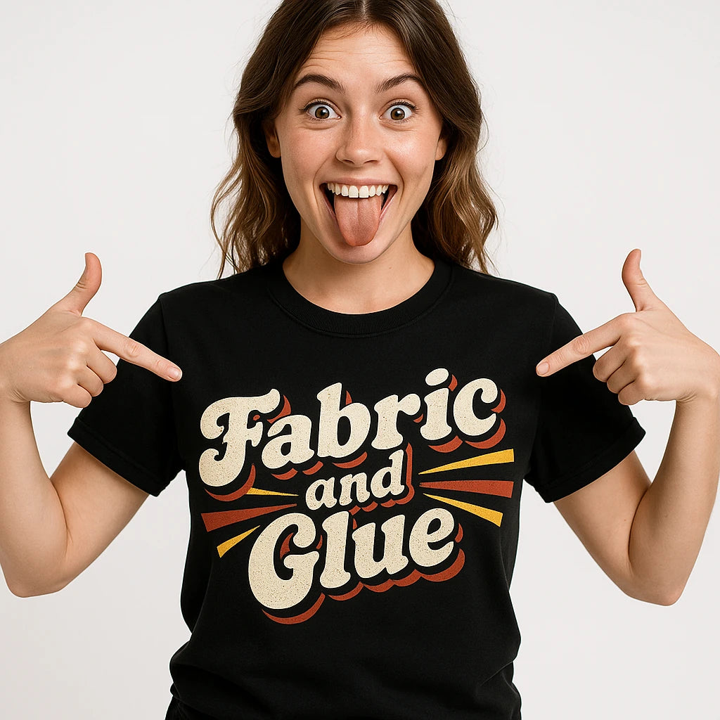 Close-up of the "Fabric and Glue" beige print on a premium Bella+Canvas black cosplayers t shirt