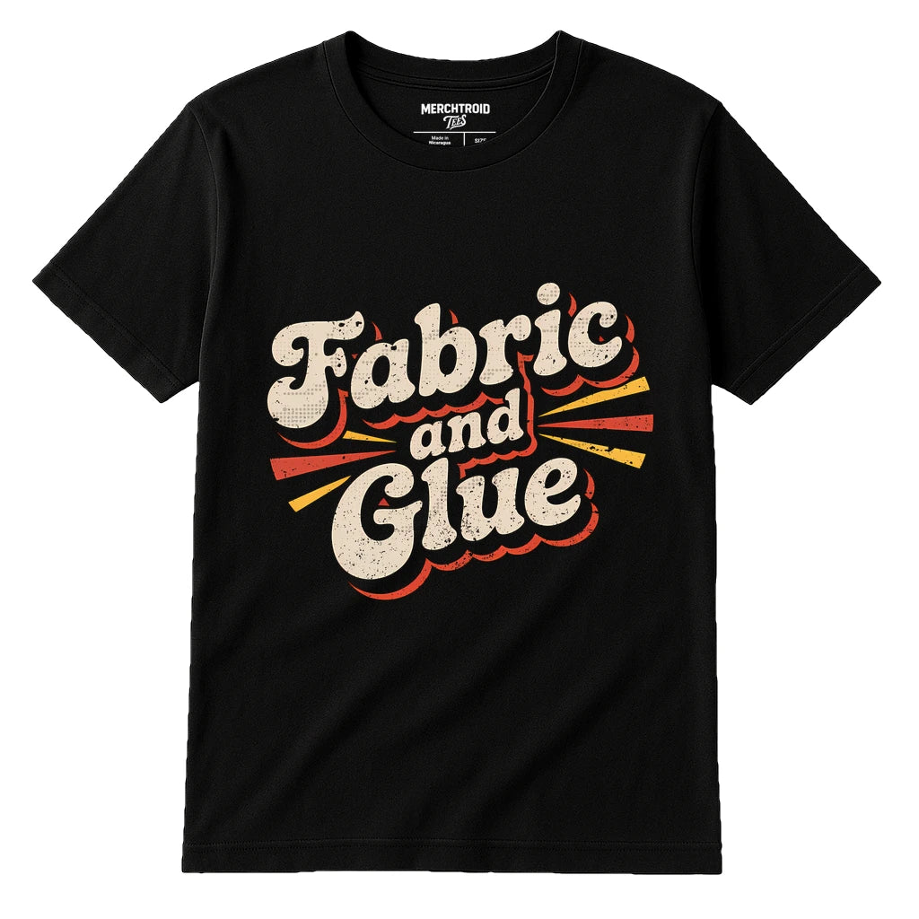 Black Cosplayers T Shirt - "Fabric and Glue" graphic tee with beige print, flat lay product photo