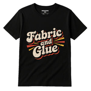 Black Cosplayers T Shirt - "Fabric and Glue" graphic tee with beige print, flat lay product photo