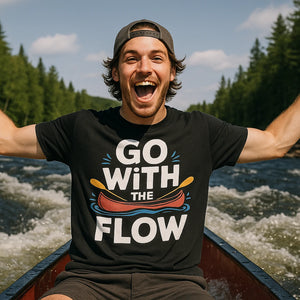 Lifestyle shot of the "Go With the Flow" black beaver canoe t shirt in a real-world setting