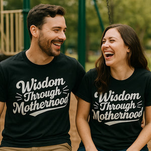 Person wearing the black mama life t shirt graphic tee - "Wisdom Through Motherhood" design