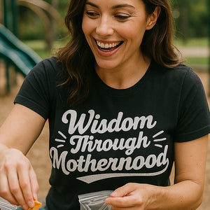 "Wisdom Through Motherhood" black mama life t shirt, photographed as mom life lover gift