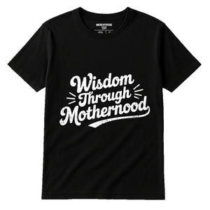 Black Mama Life T Shirt - "Wisdom Through Motherhood" graphic tee with white print, flat lay product photo