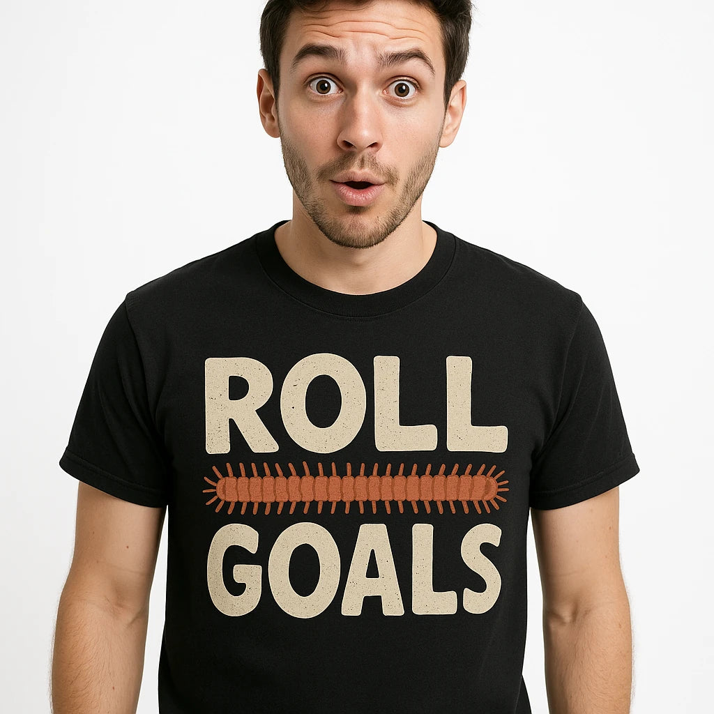 Close-up of the "Roll Goals" beige print on a premium Bella+Canvas black millipede t shirt