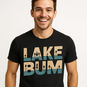 Close-up of the "Lake Bum" tan print on a premium Bella+Canvas black lake t shirt