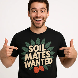 Close-up of the "Soil Mates Wanted" beige print on a premium Bella+Canvas black botany t shirt