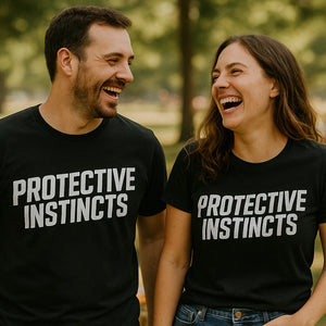 Person wearing the black dad son matching shirts graphic tee - "Protective Instincts" design