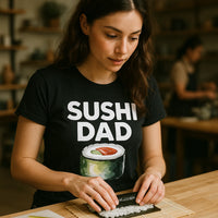 A person wearing a black t-shirt with the text 