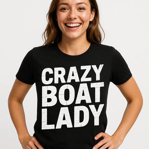 Close-up of the "Crazy Boat Lady" white print on a premium Bella+Canvas black boats and hoes t shirt