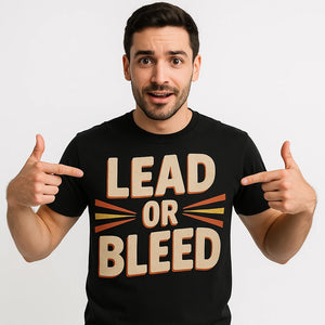 Close-up of the "Lead Or Bleed" beige print on a premium Bella+Canvas black journalist t shirt