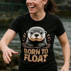 "Born To Float" black sea otter t shirt, photographed as gifts for sea otter lovers