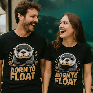Person wearing the black sea otter t shirt graphic tee - "Born To Float" design