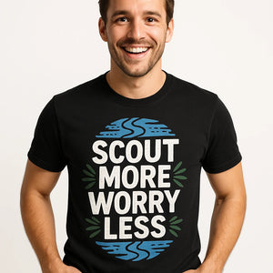Close-up of the "Scout More Worry Less" white print on a premium Bella+Canvas black rivers t shirt