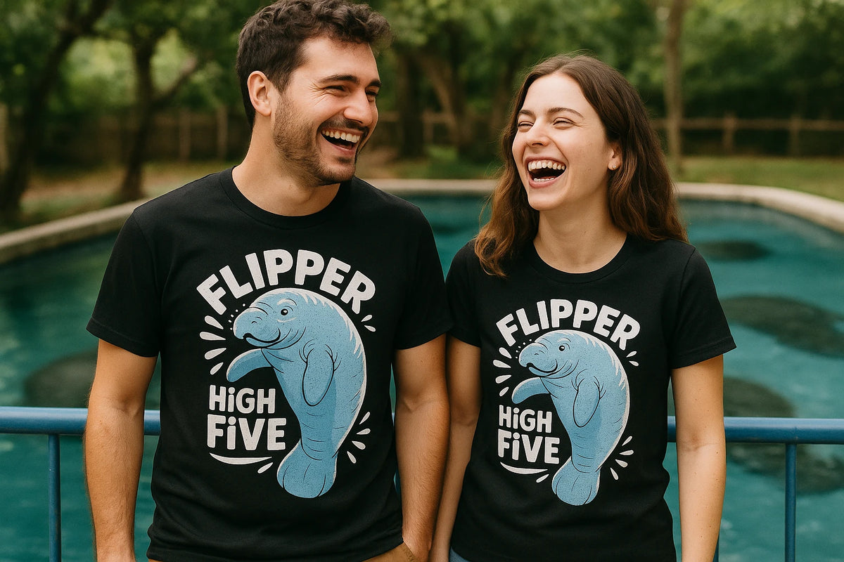 Person wearing the black manatee t shirt graphic tee - "Flipper High Five" design