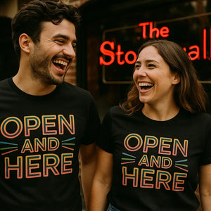 Person wearing the black lgbtq ally t shirt graphic tee - "Open and Here" design