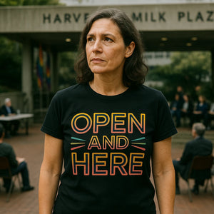 Lifestyle shot of the "Open and Here" black lgbtq ally t shirt in a real-world setting