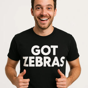 Close-up of the "Got Zebras" white print on a premium Bella+Canvas black zookeeper shirts