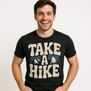 Close-up of the "Take a Hike" beige print on a premium Bella+Canvas black shirts for trekking