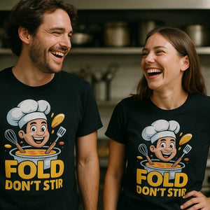 Person wearing the black cooking t shirt graphic tee - "Fold Don'T Stir" design