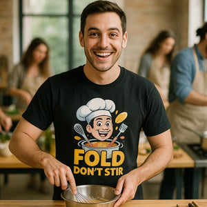 Lifestyle shot of the "Fold Don'T Stir" black cooking t shirt in a real-world setting