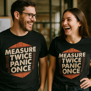 Person wearing the black architect t shirt graphic tee - "Measure Twice Panic Once" design