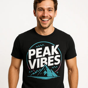 Close-up of the "Peak Vibes" white print on a premium Bella+Canvas black hiking shirts