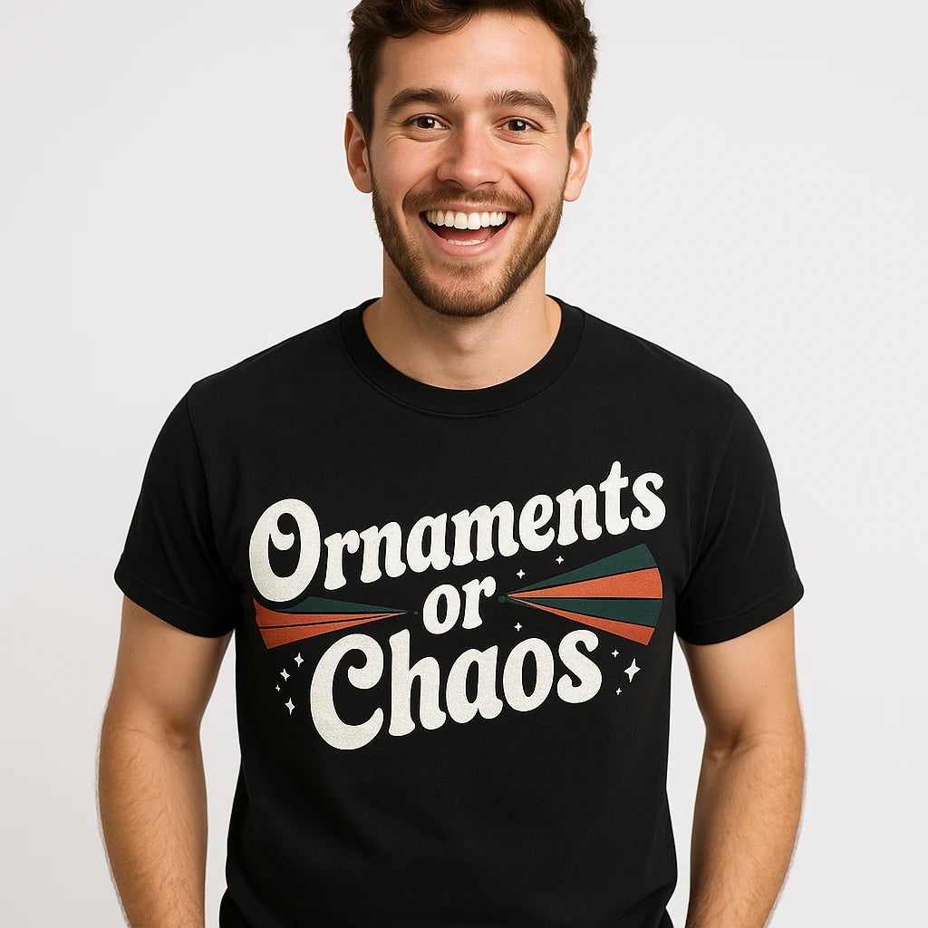 Close-up of the "Ornaments Or Chaos" white print on a premium Bella+Canvas black mens christmas shirts