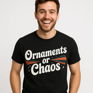 Close-up of the "Ornaments Or Chaos" white print on a premium Bella+Canvas black mens christmas shirts