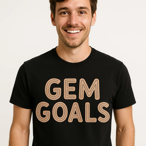 Close-up of the "Gem Goals" tan print on a premium Bella+Canvas black jewelry making t shirt