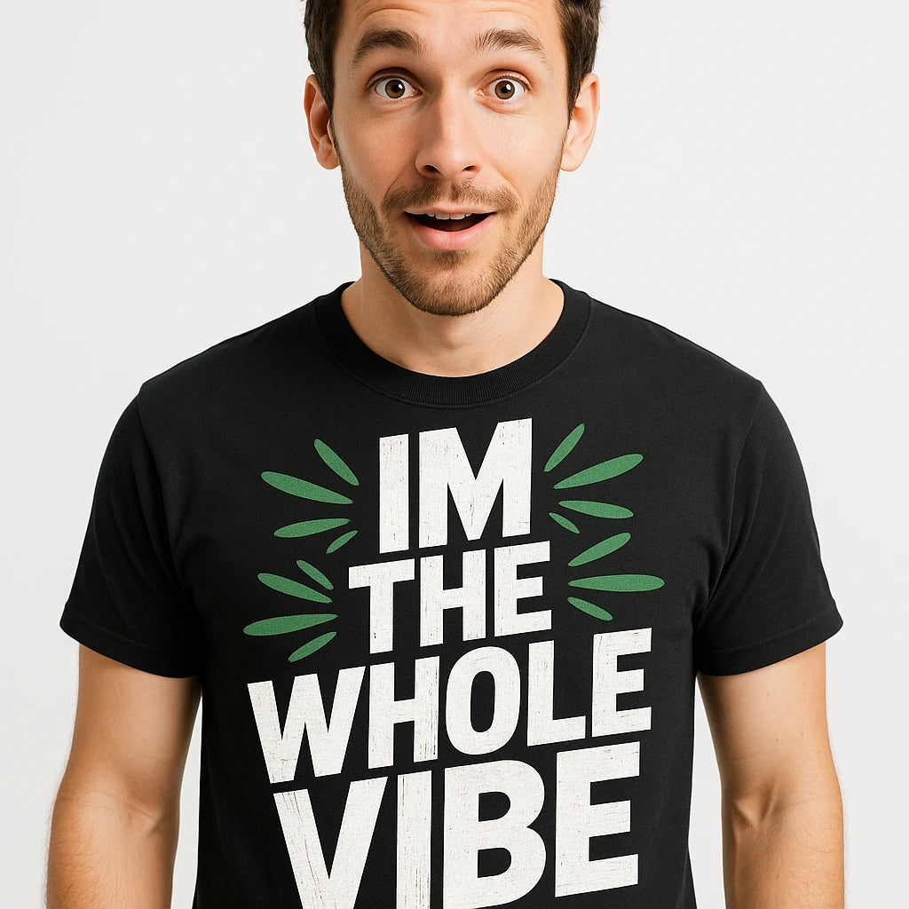 Close-up of the "Im the Whole Vibe" white print on a premium Bella+Canvas black growth mindset t shirt