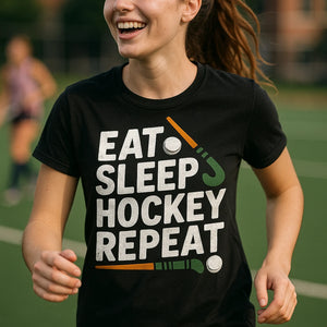 "Eat Sleep Hockey Repeat" black field hockey tee shirts, photographed as gifts for field hockey lovers