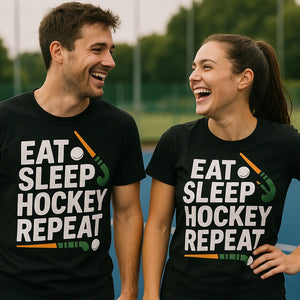 Person wearing the black field hockey tee shirts graphic tee - "Eat Sleep Hockey Repeat" design