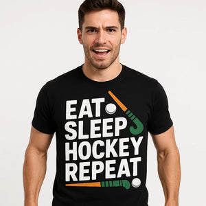 Close-up of the "Eat Sleep Hockey Repeat" white print on a premium Bella+Canvas black field hockey tee shirts
