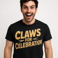 A person with dark hair and a beard is wearing a black t-shirt with the text 