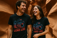 A man and a woman are standing side by side, both wearing black T-shirts with a graphic of a camera above the text 